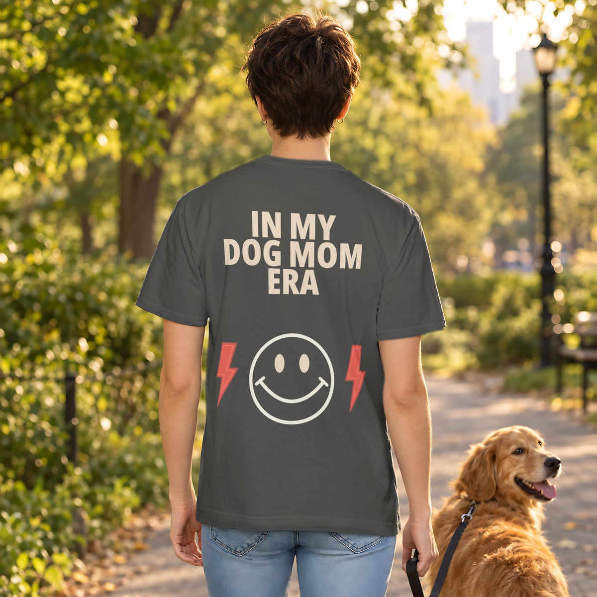 In My Dog Mom Era Tee in Pepper, back view worn by a woman outdoors
